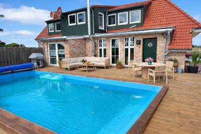 Foto 2 Ferienhaus Ostfriesland Norddeich & Umgebung Huus an`t Diek, Luxus in Deichnähe, Erdgeschosswohnung mit Pool, Nähe Norddeich (Objekt 85219) suchen